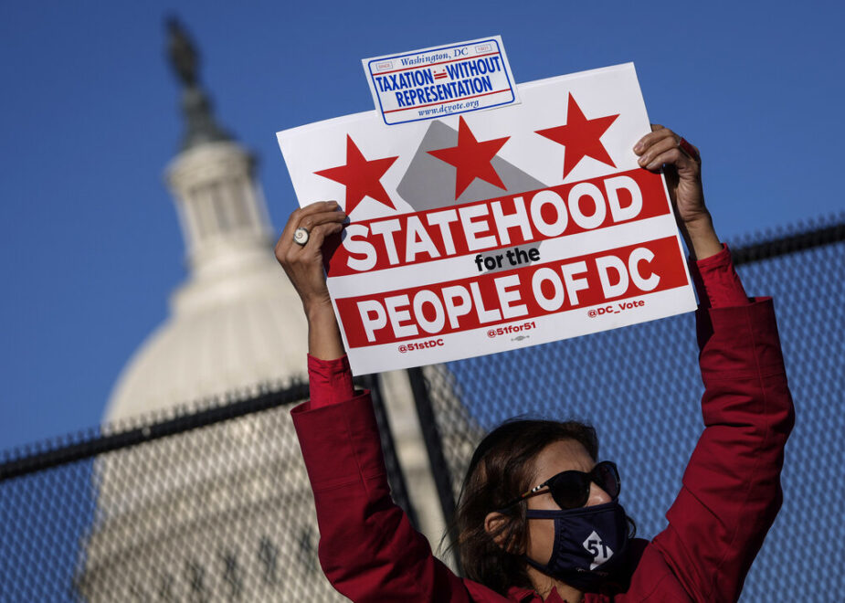 WASHINGTON, DC - MARCH 22: Residents of the District of Columbia rally for statehood near the U.S. Capitol on March 22, 2021 in Washington, DC. On Monday, the House Oversight Committee is holding a hearing on legislation that the House passed last Summer that would establish the District of Columbia as the 51st state. The District has a population of nearly 700,000 residents. (Photo by Drew Angerer/Getty Images)
